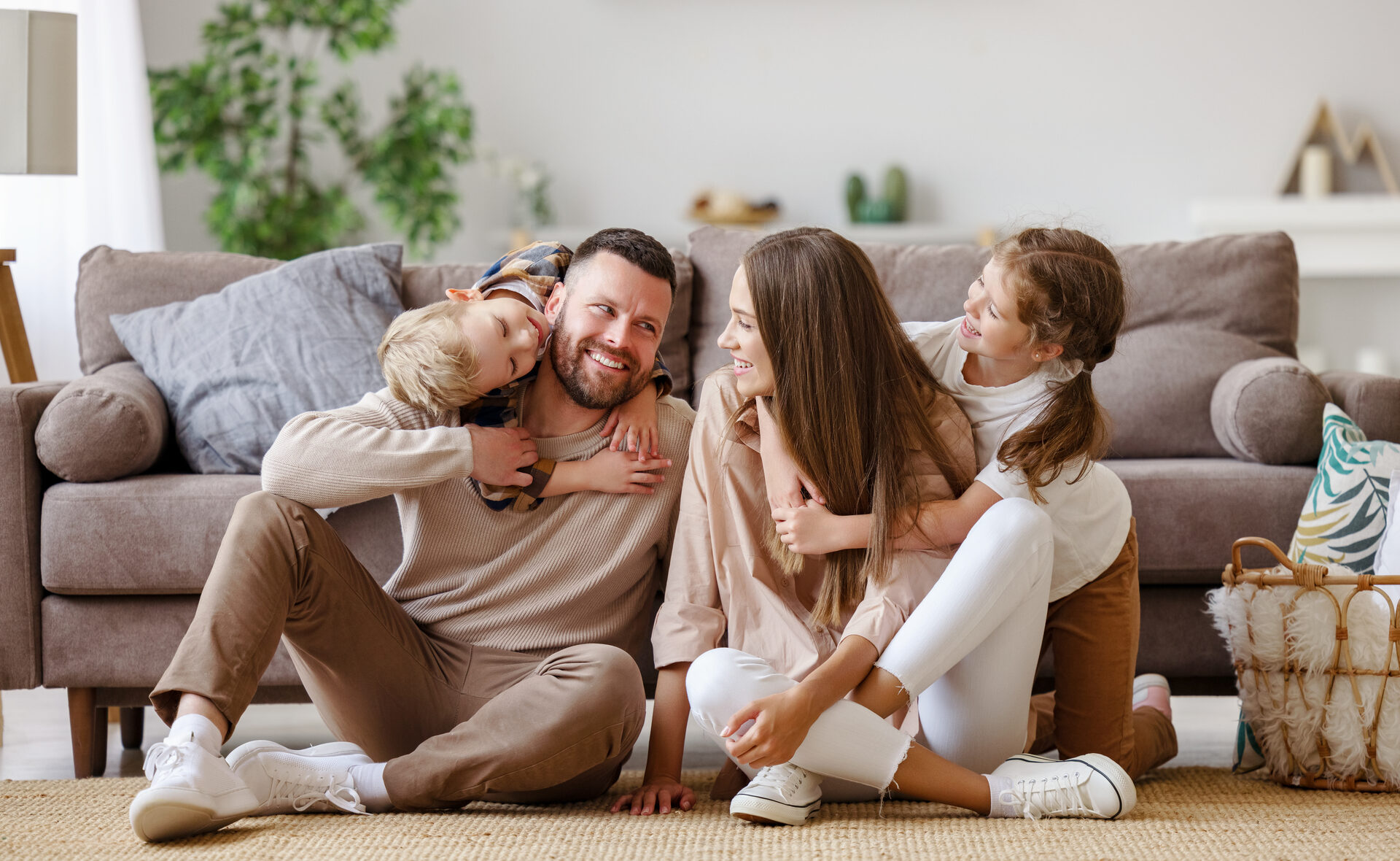 Happy family sitting together in a living room