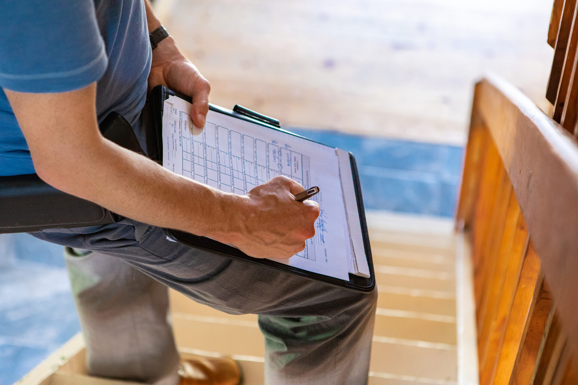 Home inspector reviewing notes on a clipboard